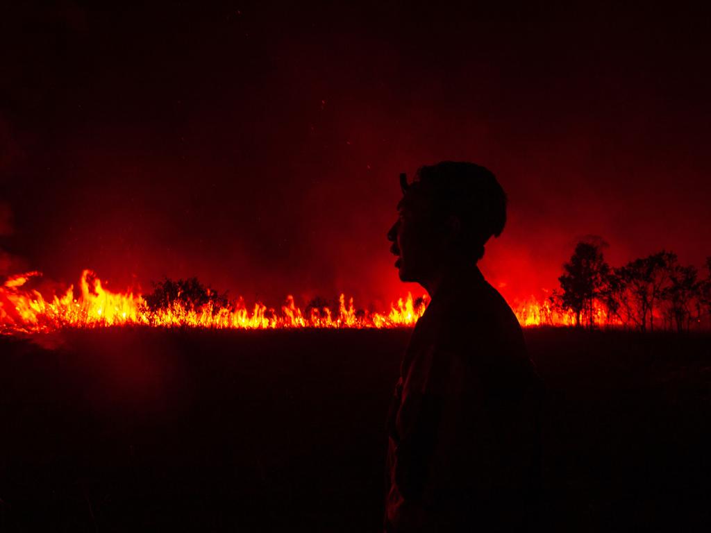 A firefighter reacts as they attempt to extinguish a wildfire in Ogan Ilir, South Sumatra. Hundreds of hectares of land have burned over the past two days, worsening the air quality in the city of Palembang. Picture: Ai Zulkifli/AFP