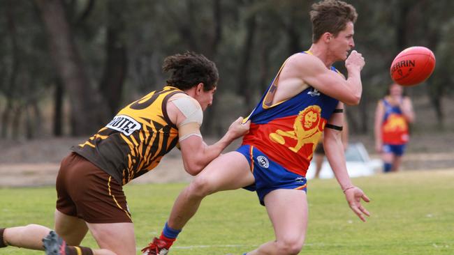 Millewa Football League Round 13 match between Gol Gol and Cardross. Gol Gol 12.12 (84) defeated Cardross 4.13 (37). Cardross' Jayden Kitt gets a handpass away under pressure from Gol Gol's Zak Russell. Picture: Glenn Milne