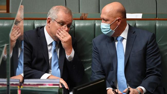 Scott Morrison and Defence Minister Peter Dutton in the House Of Representatives at Parliament House in Canberra on Thursday. Picture: AAP