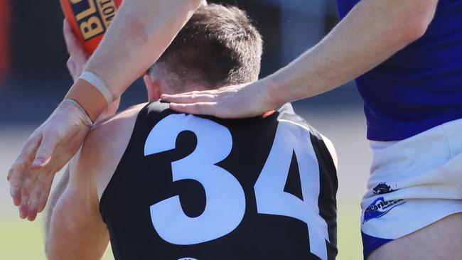 Colac Tigers player Angus Uwland tries to hold on to the ball. Picture: Mark Wilson