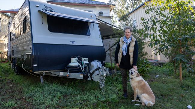 Julia Melvin and her dog Bella have been living in a caravan in the backyard of her South Lismore home. Picture: Danielle Smith