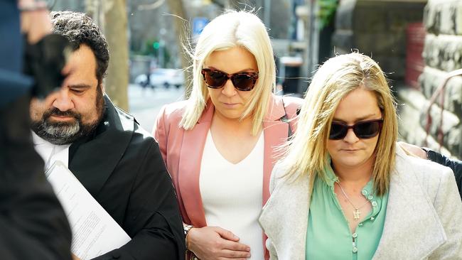 Monique Ooms (centre) did not speak as she left court on Tuesday. Picture: NCA NewsWire / Luis Enrique Ascui