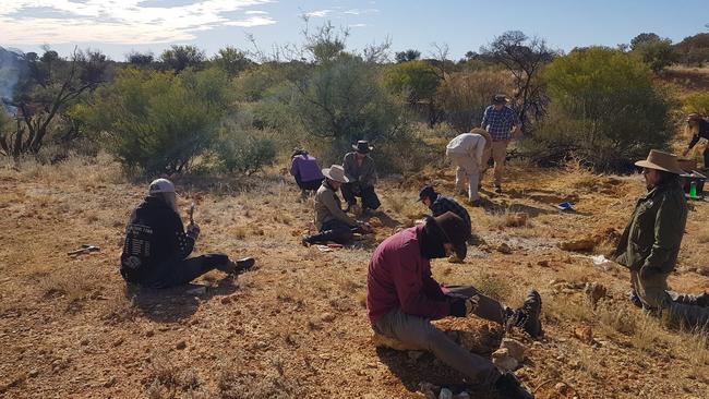 Flinders University palaeontologists at Pwerte Marnte Marnte fossil site. Picture: Arthur Crichton