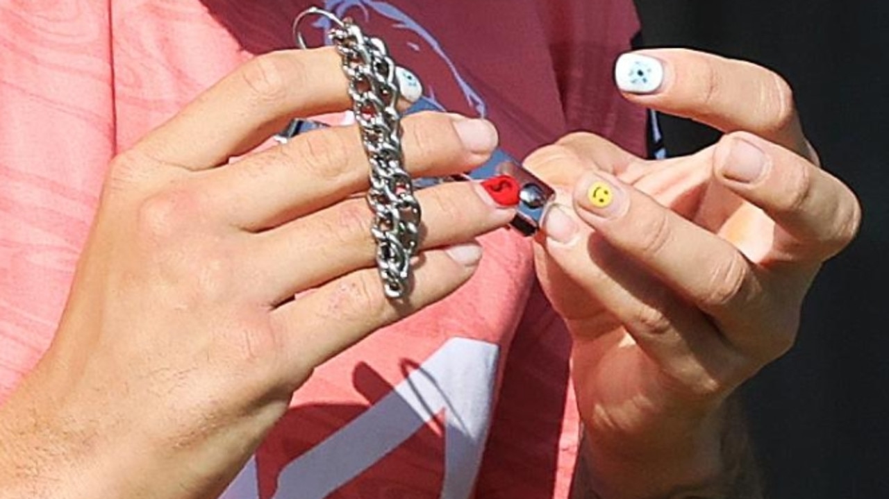 Reece Walsh with his decorated finger nails.