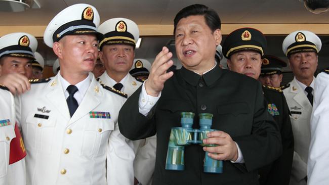 Chinese President Xi Jinping inspects a Chinese Haikou Type 052C destroyer.