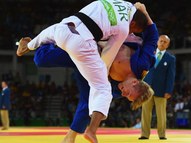 RIO DE JANEIRO, BRAZIL - AUGUST 07: Imad Bassou of Morocco and Nathan Katz of Australia (blue) compete during the Men's -66kg Elimination round of 32 on Day 2 of the Rio 2016 Olympic Games at Carioca Arena 2 on August 7, 2016 in Rio de Janeiro, Brazil. (Photo by Laurence Griffiths/Getty Images)