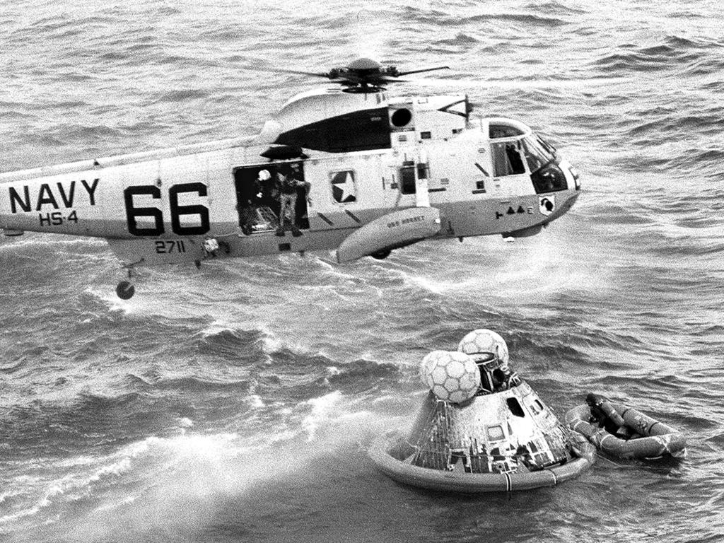 Navy UDT swimmer Clancy Hatleberg prepares to jump from a helicopter into the water next to the Apollo 11 capsule. Picture: Milt Putnam/U.S. Navy via AP