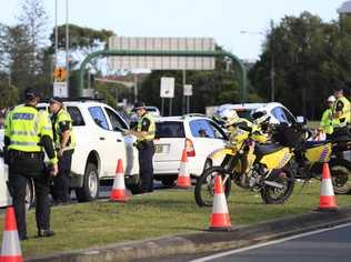 Queensland Police set up a road block due to the coronavirus at the NSW / Queensland border on the old Pacific Highway at Coolangatta. Photo: Scott Powick. Picture: Scott Powick