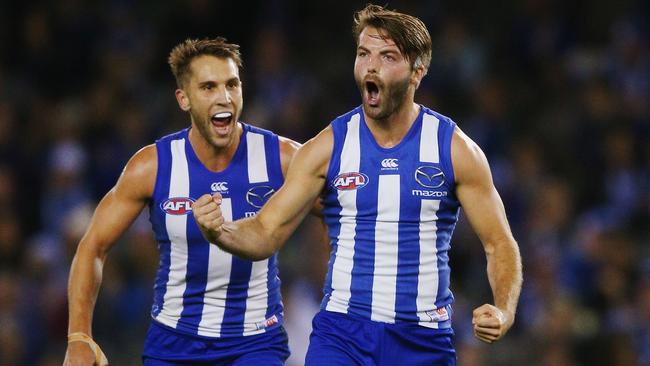 Luke McDonald and Jamie Macmillan celebrate a goal.