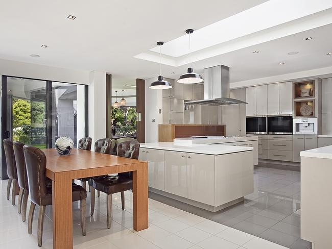 The modern kitchen features Gaggenau appliances.