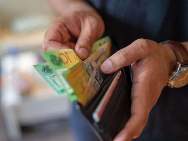 a male taking money out of the valet.  Picture: istock