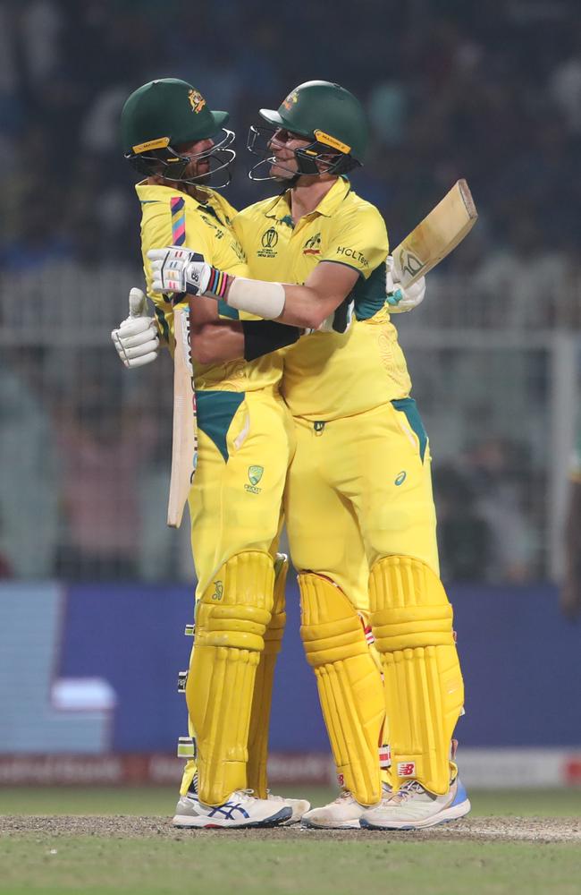 (L-R) Mitchell Starc and Australia's captain Pat Cummins celebrate their team's win over South Africa. Picture: Getty Images