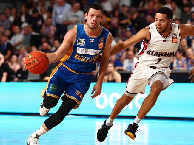 Jason Cadee spurns Tyler Harvey on Thursday in Brisbane. Picture: Chris Hyde/Getty Images