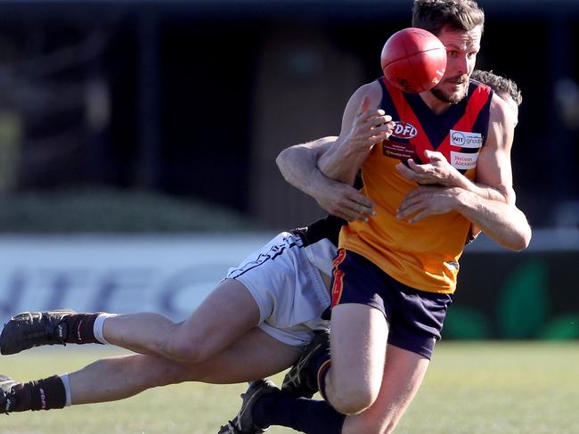 East Keilor’s Dean Roberts is tackled. Picture: Mark Dadswell