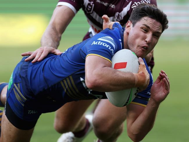 SYDNEY, AUSTRALIA - MARCH 24: Mitchell Moses of the Eels scores a try during the round three NRL match between Parramatta Eels and Manly Sea Eagles at CommBank Stadium, on March 24, 2024, in Sydney, Australia. (Photo by Cameron Spencer/Getty Images)