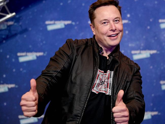 (FILES) In this file photo taken on December 1, 2020 SpaceX owner and Tesla CEO Elon Musk poses as he arrives on the red carpet for the Axel Springer Awards ceremony, in Berlin. - The fortunes of the world's ten richest men have doubled since the start of the pandemic while the incomes of 99% of humanity have shrunk, according to an Oxfam report on Monday, January 17. (Photo by Britta Pedersen / POOL / AFP)