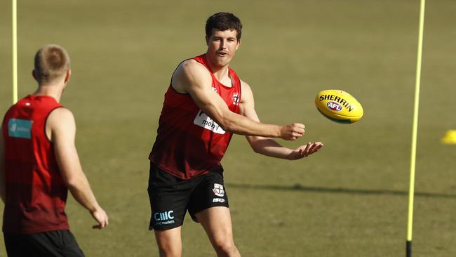 Rowan Marshall fires off a handball during St Kilda training.