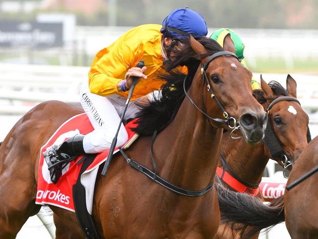 Jockey Chris Symons rides Mrs Beckham to victory from Jockey Michael Poy riding Parmie in race 5, the Margaret Hogan Handicap, during MRC Members Race Day at Caulfield Racecourse in Melbourne, Saturday, January 4, 2020. (AAP Image/Vince Caligiuri) NO ARCHIVING, EDITORIAL USE ONLY