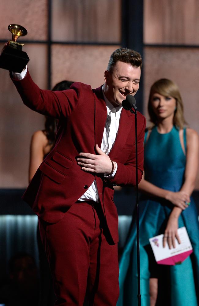 Hot property ... Singer Sam Smith (L) accepts the Best New Artist award from Taylor Swfit at the 57th Annual GRAMMY Awards in Los Angeles on February 8, 2015. Picture: Kevork Djansezian / Getty Images