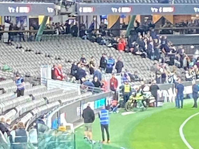 A photo showing the emergency response to a reportedly fallen woman at Marvel Stadium during the Blues-Lions fixture.