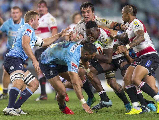 Hacjivah Dayimani of the Lions is tackled during the Round 10 Super Rugby match between the NSW Waratahs and the Lions at Allianz Stadium in Sydney, Friday, April 20, 2018. (AAP Image/Craig Golding) NO ARCHIVING, EDITORIAL USE ONLY