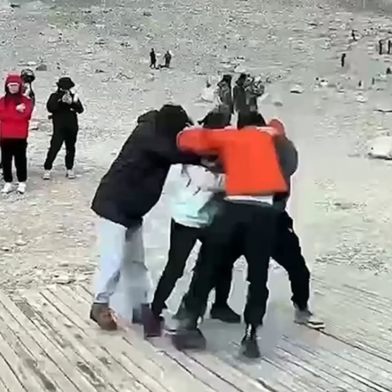 A punch-up erupted between two on the viewing platform next to the Everest Elevation Measurement Monument over the best spot to take a photograph. Picture: NewsFlare