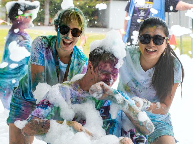 Azrae Hope, Ben Radzevicius and Risa Watanuki from Eimeo at the Mackay Colour Run 2021. Picture: Michaela Harlow