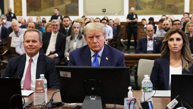 Donald Trump (C) sits with his attorneys inside the courtroom during civil fraud case brought by state Attorney-General Letitia James, at a Manhattan courthouse. Picture: AFP.