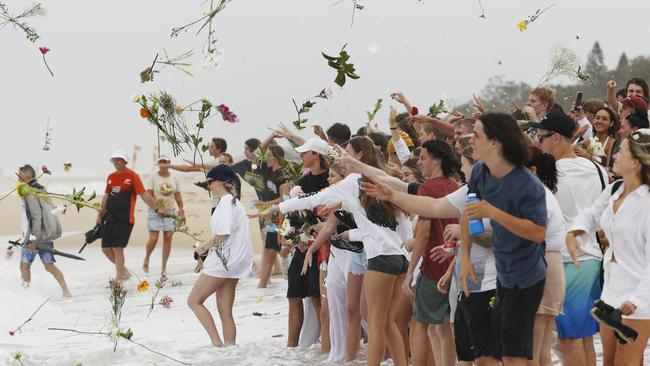 Balin Stewart’s friends and family at a beach memorial for the quirky and popular 16-year-old. Picture: Lachie Millard