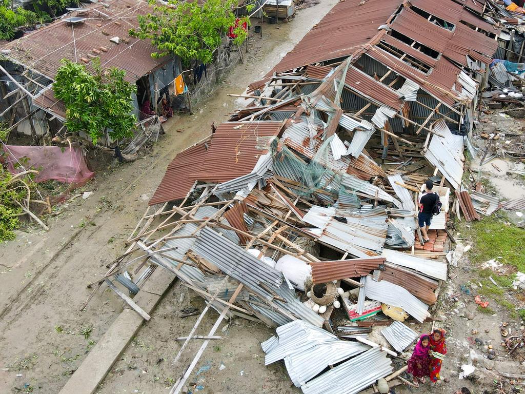 This aerial photograph shows damaged houses after cyclone Remal.