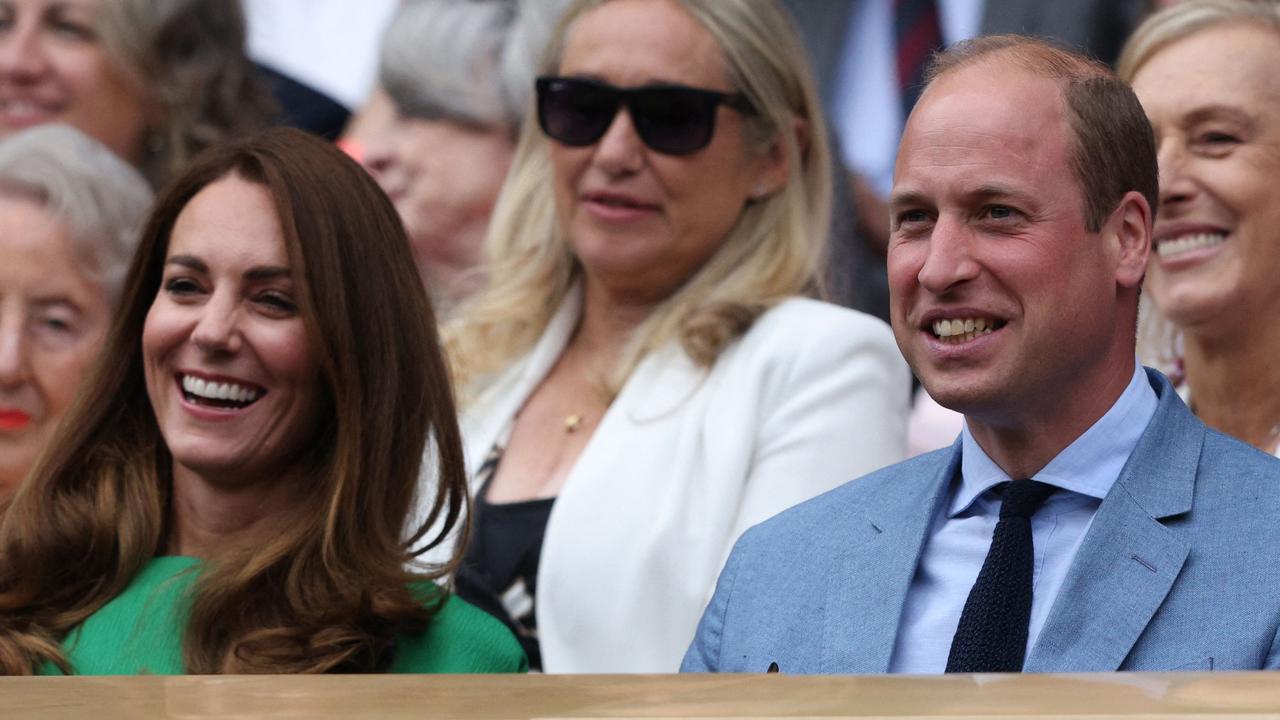 Kate and Wills enjoyed the action. (Photo by Adrian DENNIS / AFP)