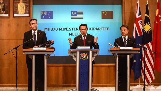 Malaysia's Transport Minister Liow Tiong Lai (C) speaks as Chinese Minister of Transport Yang Chuantang (R) and Australia's Minister for Infrastructure and Transport Darren Chester (L) during the joint press conference to announce the suspension of the MH370 search once the current area is fully scoured. Picture: AFP/Mohd Rasfan