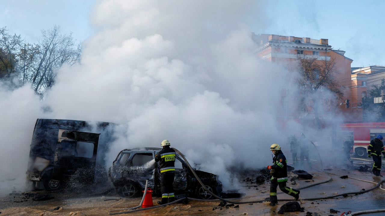 Firefighters work to put out fire at the scene of Russian missile strikes, as Russia’s attack continues, in Kyiv, Ukraine October 10, 2022. Picture: REUTERS/Valentyn Ogirenko