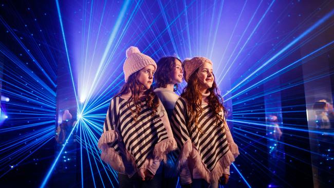 Twins Scarlett and Sienna with brother Max at Mirror Mirror, by Canada’s Moment Factory, part of Illuminate Adelaide in Victoria Square. Picture Matt Turner.