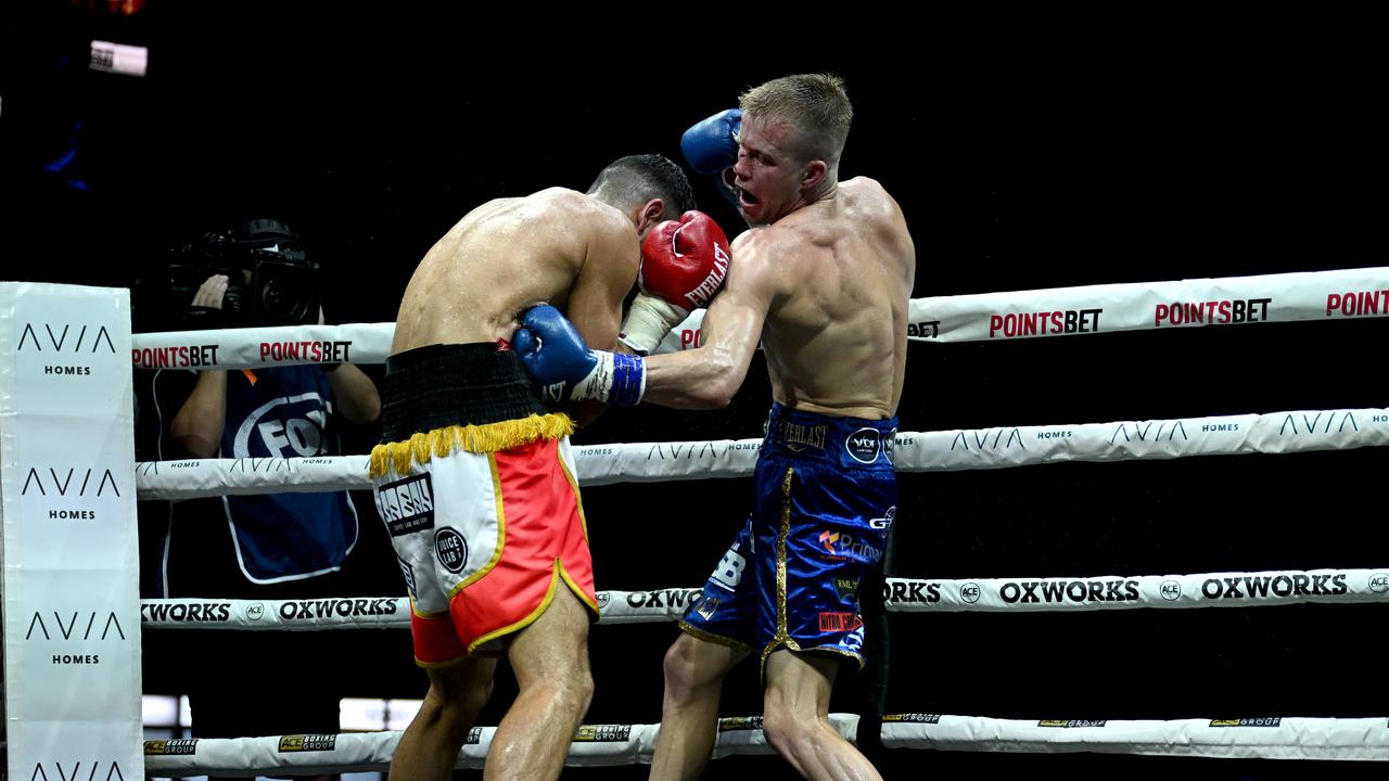 Liam Wilson goes to the body of Youssef Dib. Photo: No Limit Boxing.