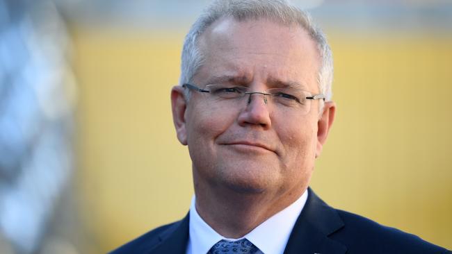 Prime Minister Scott Morrison says the borders should reopen despite the spike in cases. (AAP Image/Joel Carrett)