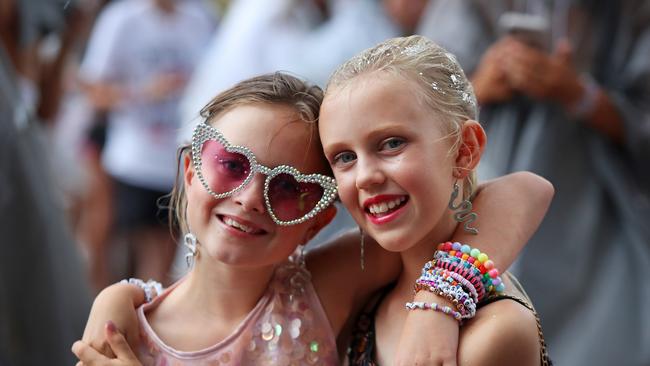 Young Taylor Swift fans embrace outside Accor Stadium.