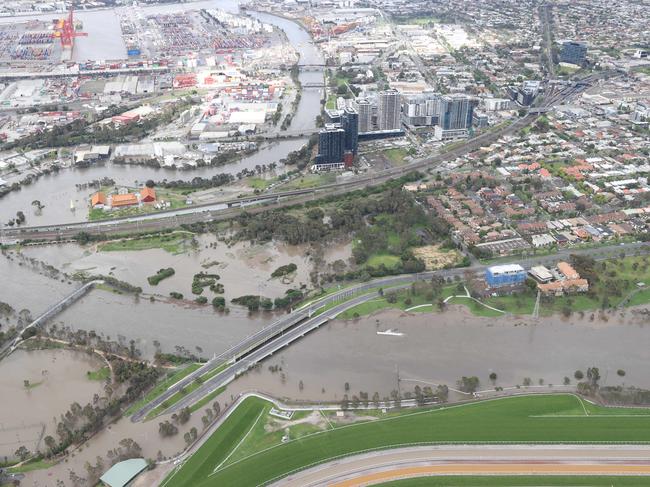 Aerial photos of flood waters enter homes and streets by the Maribyrnong River in the Flemington area. Picture: David Caird