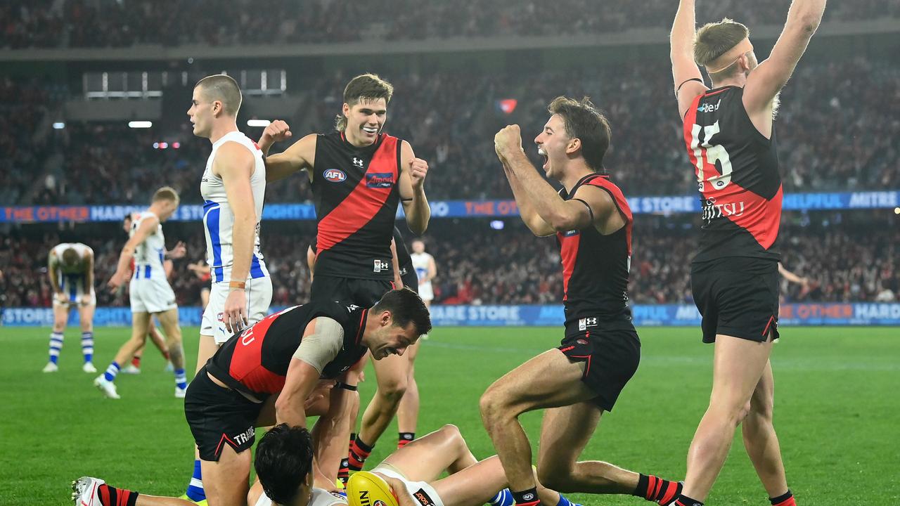 The Bombers celebrate on the final siren on Sunday. Picture: Quinn Rooney/Getty Images