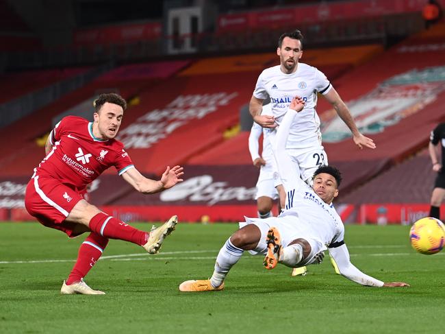 LIVERPOOL, ENGLAND - NOVEMBER 22: Diogo Jota of Liverpool shoots past James Justin of Leicester City during the Premier League match between Liverpool and Leicester City at Anfield on November 22, 2020 in Liverpool, England. Sporting stadiums around the UK remain under strict restrictions due to the Coronavirus Pandemic as Government social distancing laws prohibit fans inside venues resulting in games being played behind closed doors. (Photo by Laurence Griffiths/Getty Images)