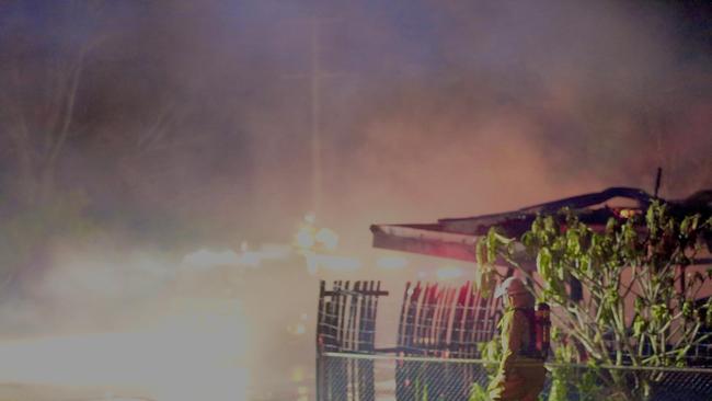 A firefighter on the scene of a blaze in Kent St, Maryborough on Tuesday night. PHOTO: Robyne Cuerel