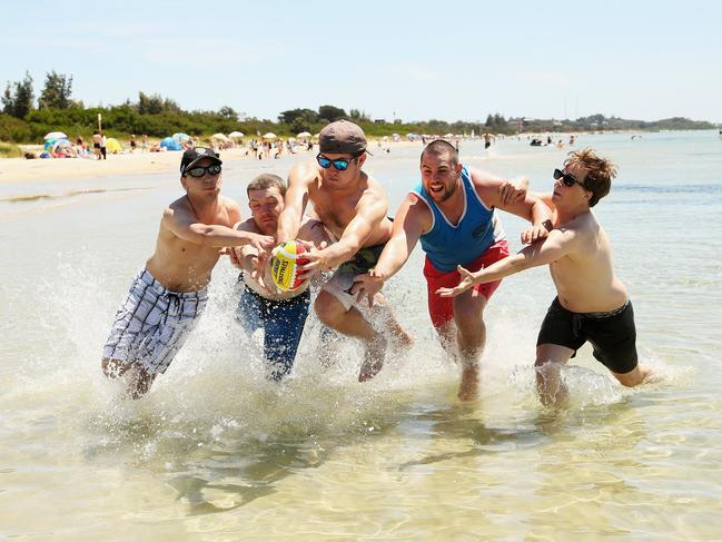 Celebrating the end of 2012 at Rye beach (from left) Chris Venn, Dean Jones, James Hyde, Aaron O'Mara and Jake Robertson, all of East Bentleigh. Picture: Hamish Blair