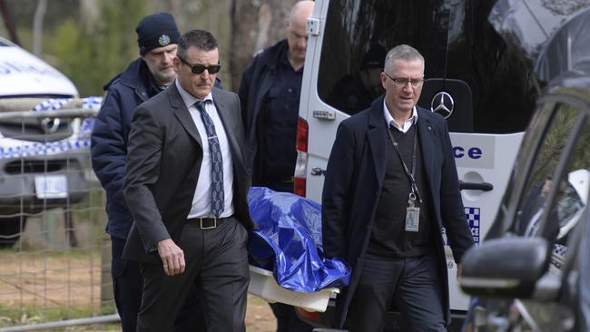 The human remains are removed from Hale conservation park at Williamstown, north of Adelaide. Picture: Roy VanDervegt