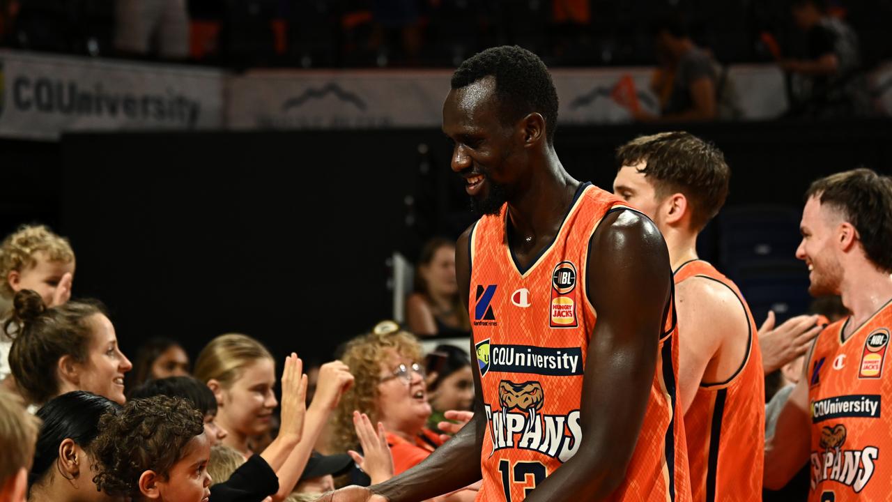 Taipans gun Majok Deng celebrates with fans after the big win against Melbourne United. (Photo by Emily Barker/Getty Images)