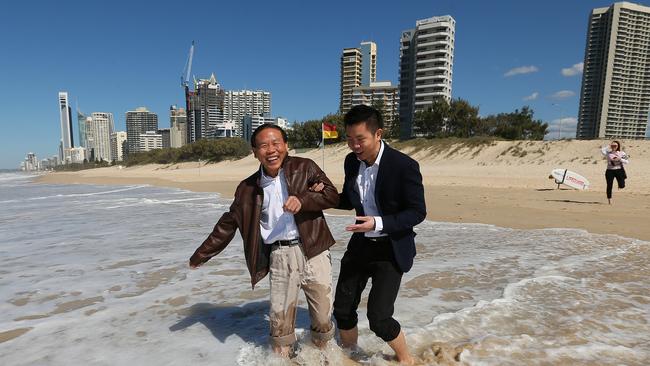 Ri Yu Li, Chairman of Ridong group, relaxes with son Tony Li, with Jewel going up in the background.