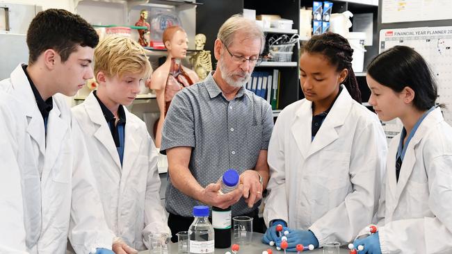 Kawana Waters State College students Rick Helberg, Neah Newbury, Wahida Kelm and Annabelle Pancer-Lee learn new science skills from retiring teacher Jim Bailey. Picture: Patrick Woods