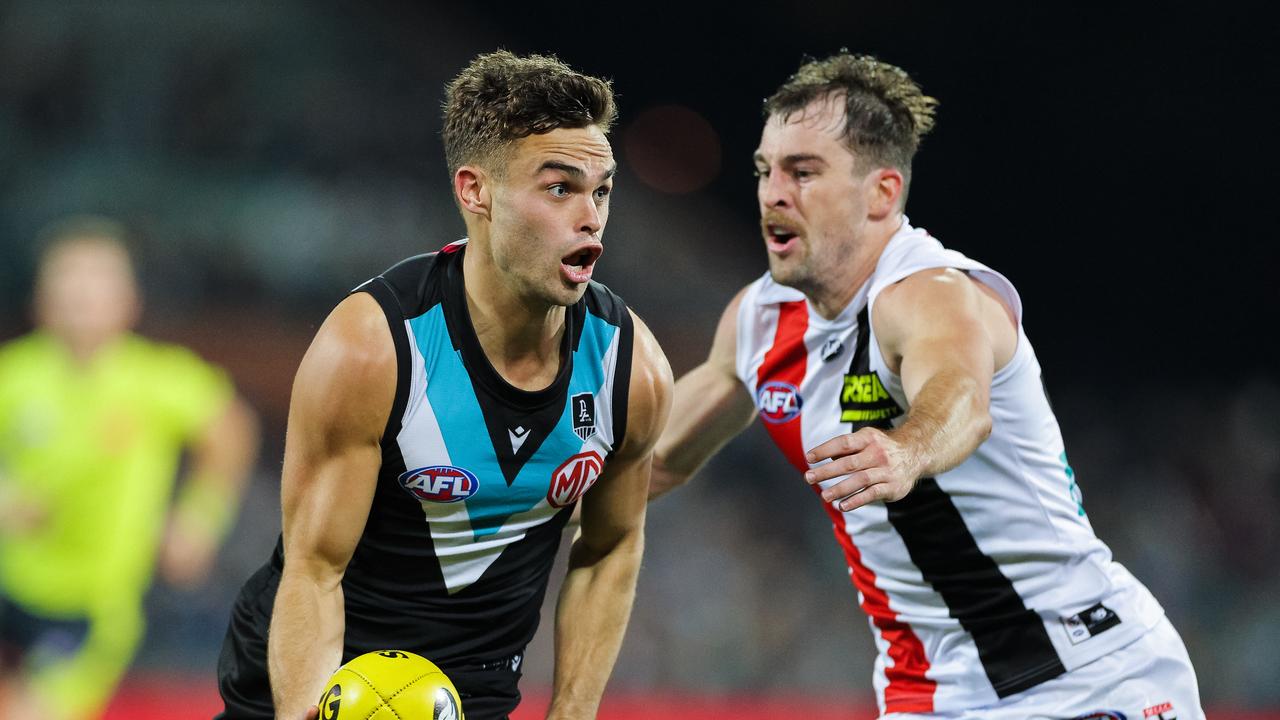 ADELAIDE, AUSTRALIA – APRIL 25: Karl Amon of the Power handballs during the round six AFL match between the Port Adelaide Power and the St Kilda Saints at Adelaide Oval on April 25, 2021 in Adelaide, Australia. (Photo by Daniel Kalisz/Getty Images)