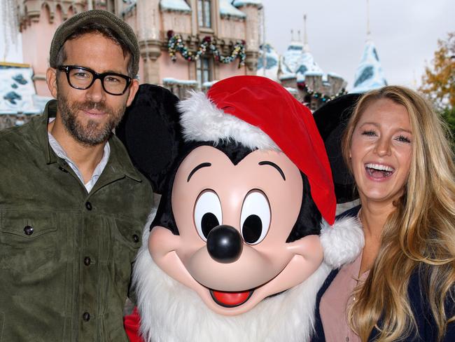 Ryan Reynolds and Blake Lively meet Mickey Mouse at Sleeping Beauty's Winter Castle at Disneyland.  Picture:  Getty
