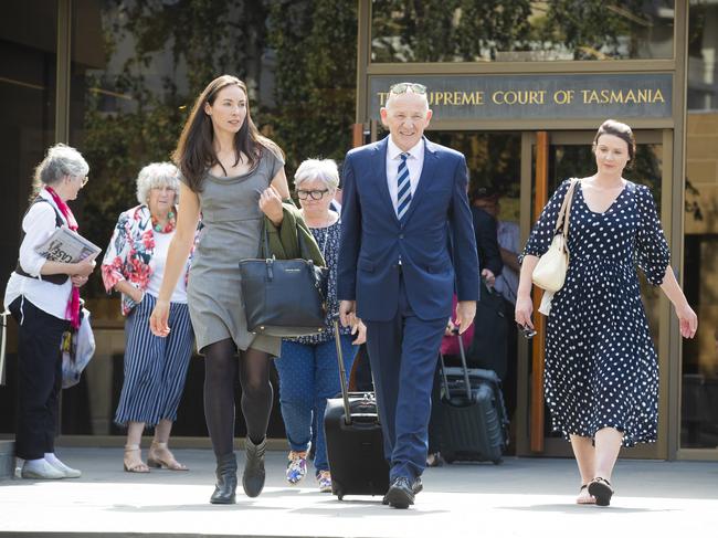 Sue Neill-Fraser's daughters Sarah Bowles (left) and Emma Fraser-Meeker (right) with Barrister Tom Percy QC (centre) during her appeal application. Picture: RICHARD JUPE