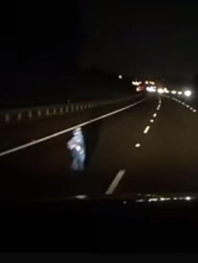 Dashcam footage shows the figure standing in the middle of one of the highway lanes. Picture: Mitch Kuhne/Facebook